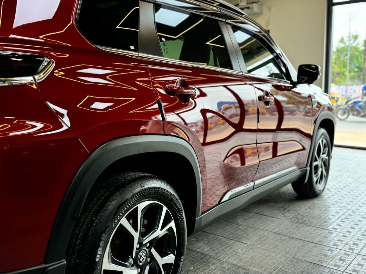 Red Toyota Hyryder with paint protection film